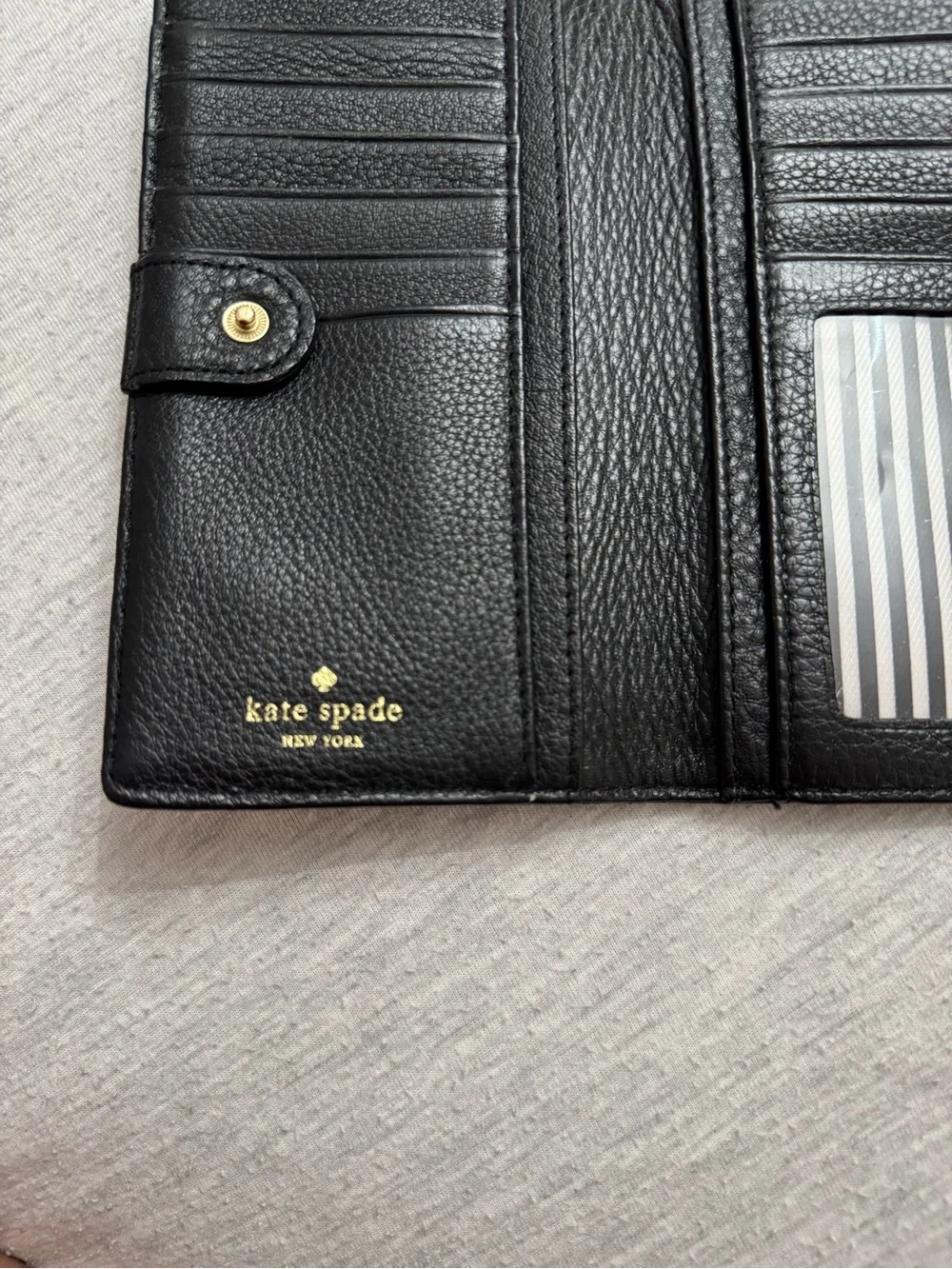 kate spade Black Pebbled Leather Continental Wallet with Gold Logo